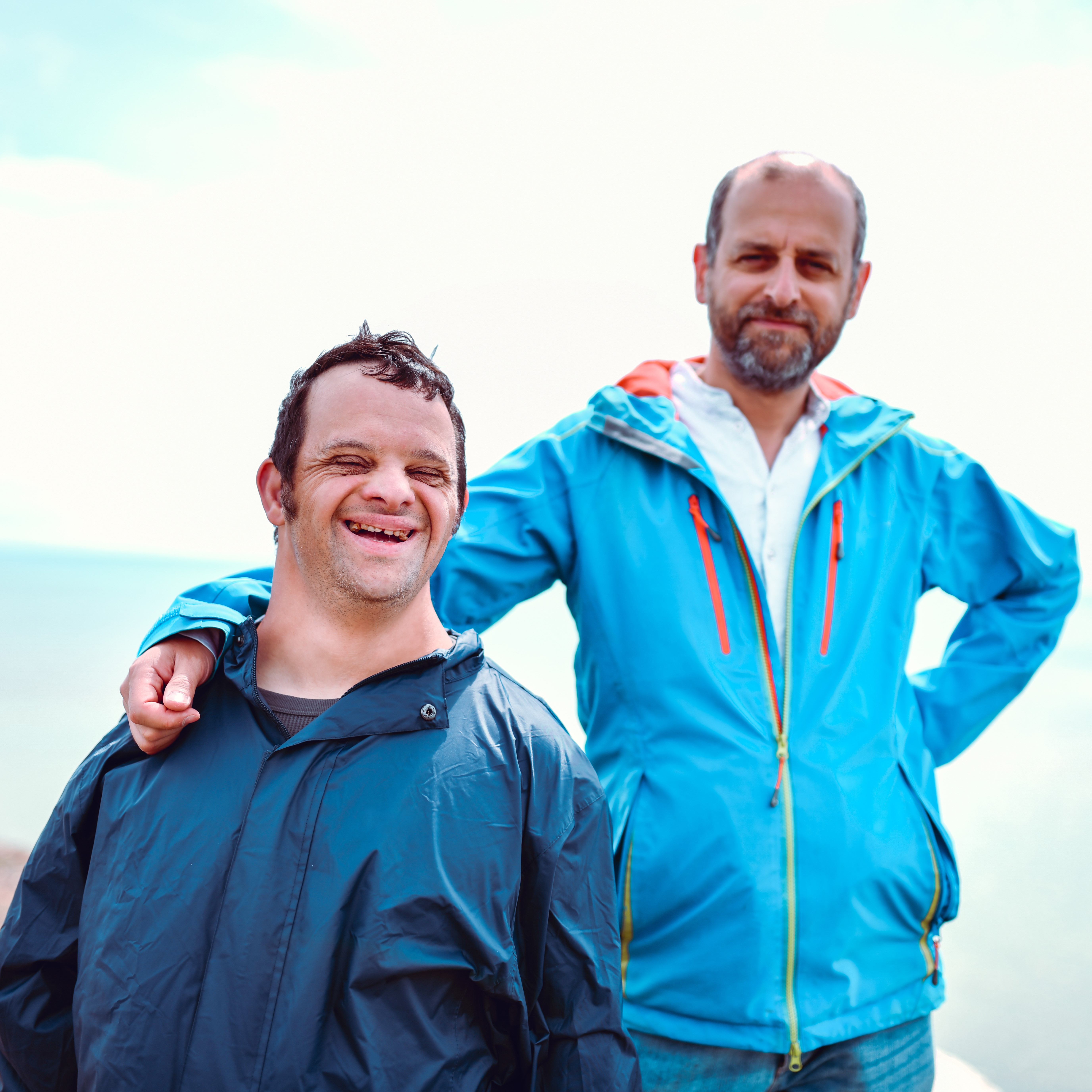 Image of two men smiling outside