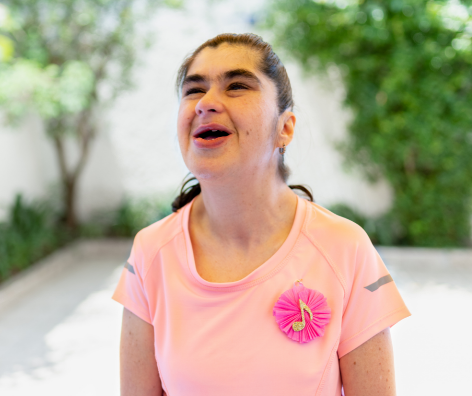 Image of a young woman smiling outside